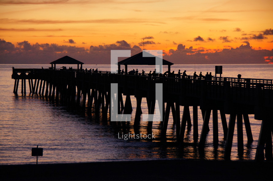 Atlantic Ocean sunrise over fishermen's pier.