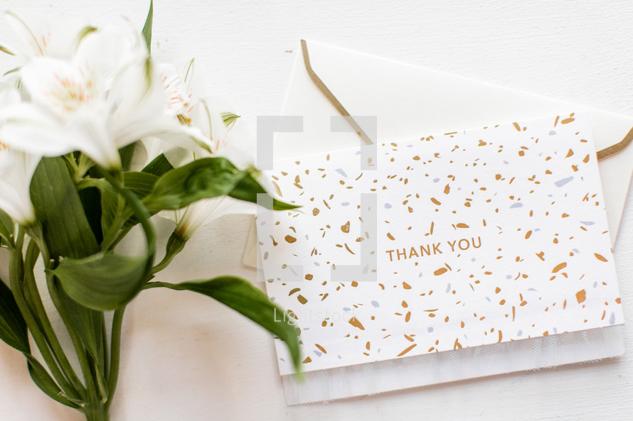 thank you card and white flowers 