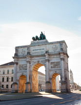 The Victory Gate (Siegestor), a three arched triumphal arch crowned with a statue of Bavaria with a lion quadriga in Munich, Germany
