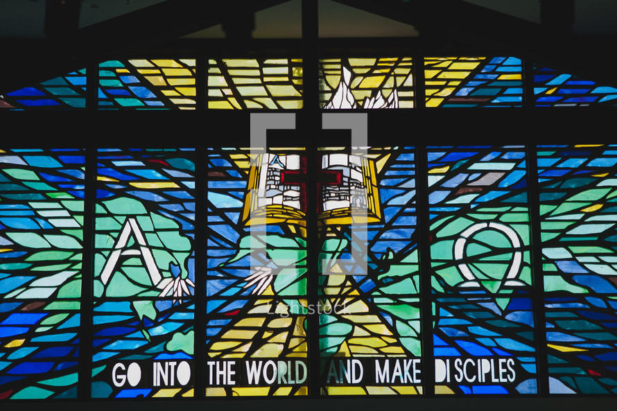 stained glass window and words GO INTO THE WORLD AND MAKE DISCIPLES