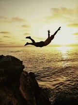 man cliff jumping 