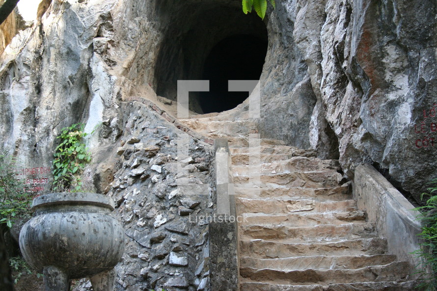 stairs leading up to a tunnel