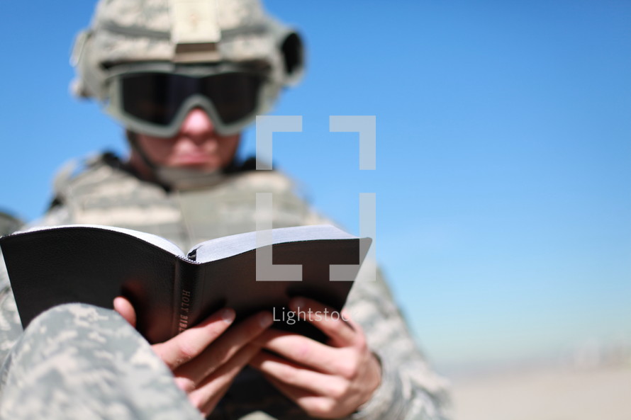 soldier reading a Bible