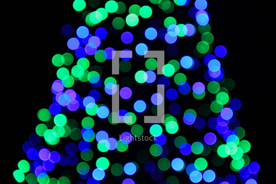 green and blue bokeh lights on a Christmas tree