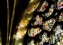 sunlight shining through stained glass windows 