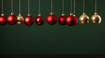Red and gold Christmas ornaments and decorations on a green background