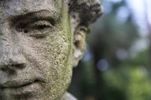 Outdoor statue of a man's face.