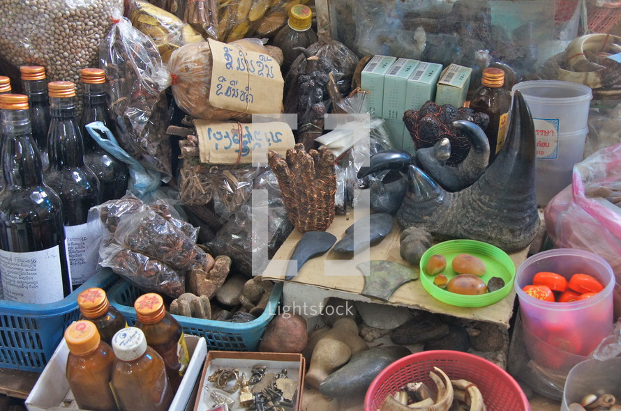 Tribal witchcraft potions and objects  Note Rhino horn at centre. 