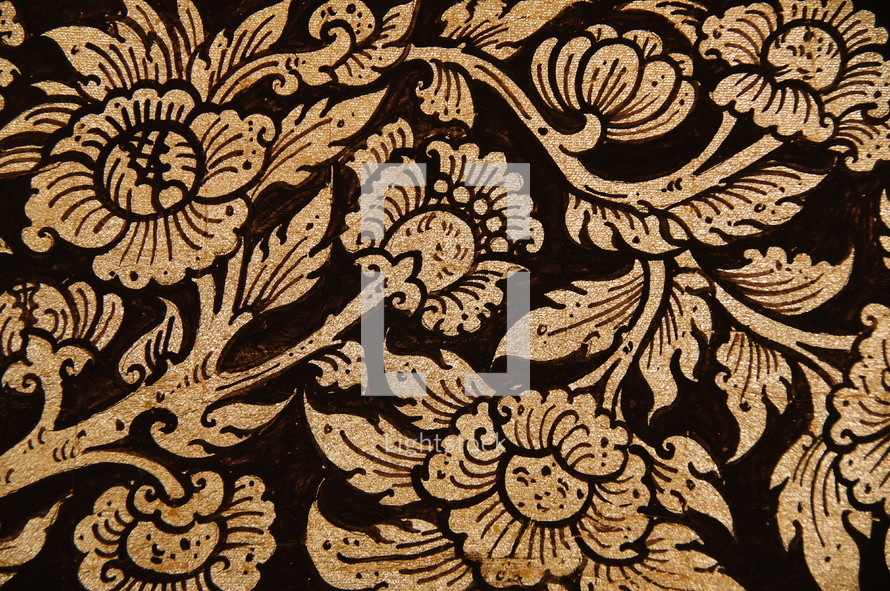 Laotian flower pattern. Gold foil on painted wood. Abstract floral background