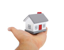 House model toy plastic in hand on white background