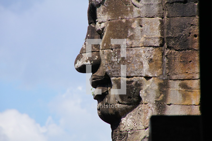 buddhist sculpture in towers of Bayon temple
