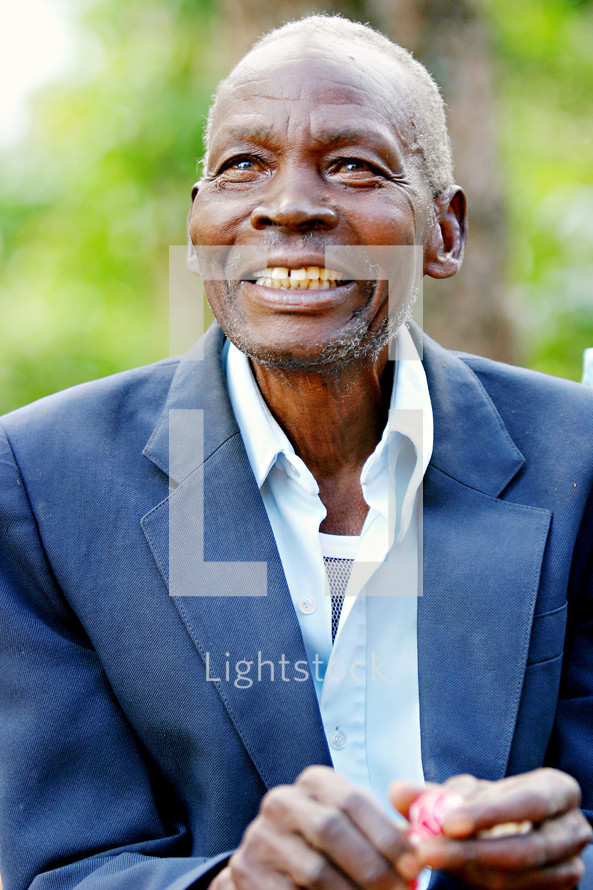 smiling african man in a blazer, uganda africa missions