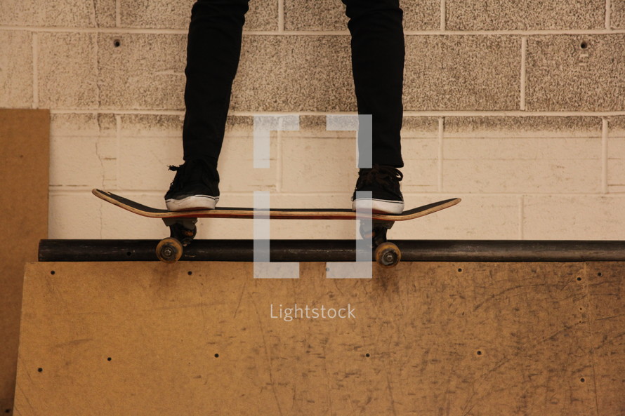 skateboarder on a ramp ledge