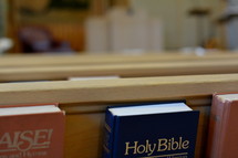 A Bible in the back of a pew 