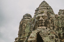 carved faces in temple ruins in Cambodia 