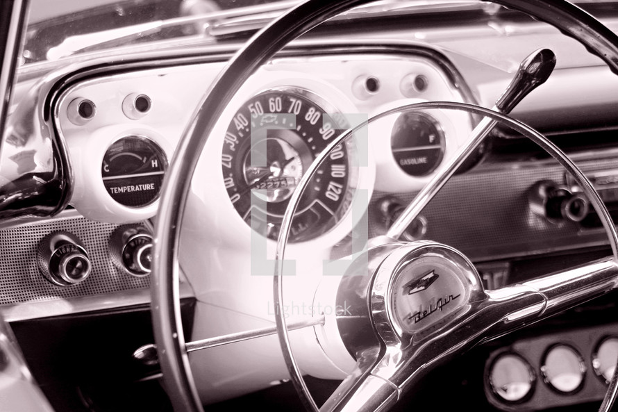 steering wheel and dash  of an old 57' chevy bel air car auto automobile automotive classic