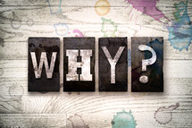 word why? on a white wash wood background 