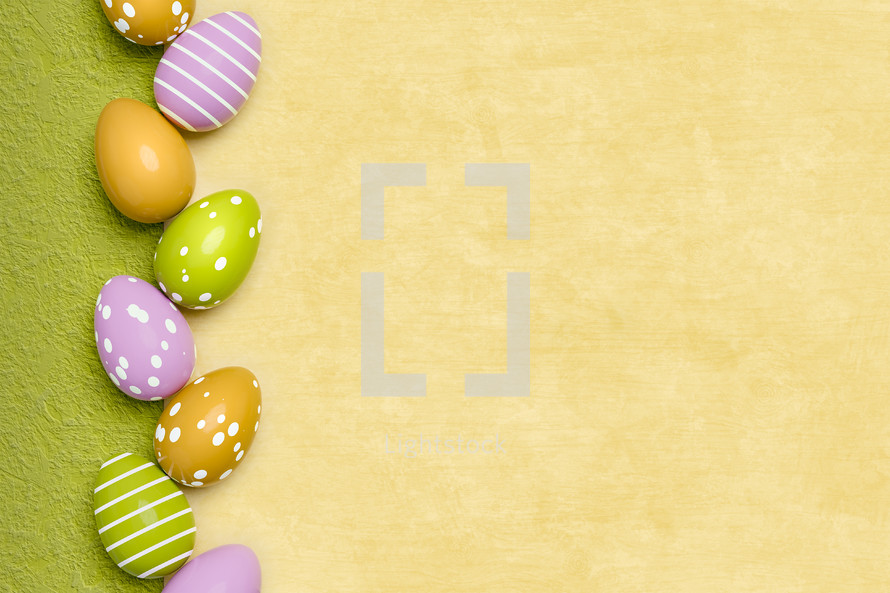 green and yellow background with Easter eggs 