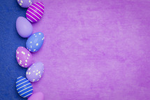 blue and purple background with Easter eggs 