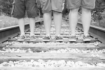 boys on train tracks 