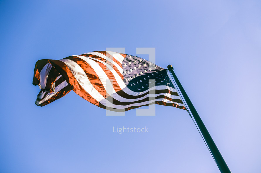 An American flag on a flag pole 