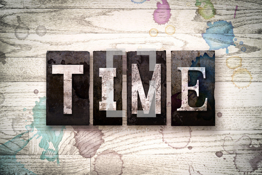 word time on a white wash wood background 