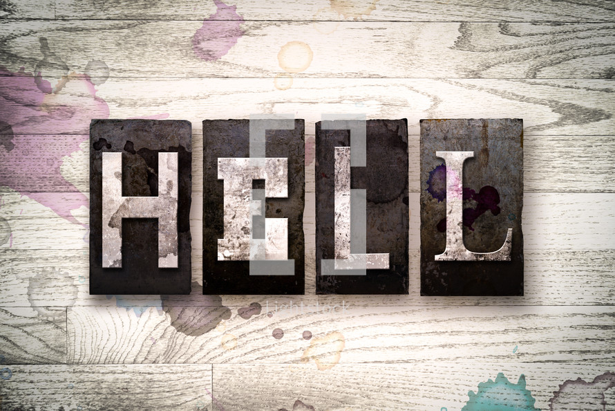 word hell on wood background 