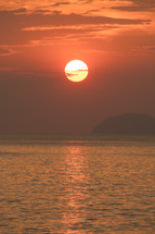 sun setting over the ocean 