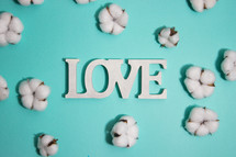 word love and cotton on a turquoise background 