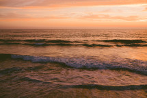 Beach waves at sunset