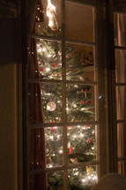 A Christmas tree in a window 