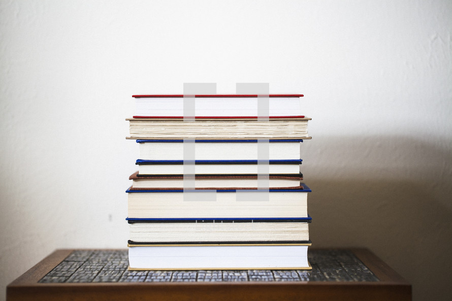stack of books on a table 