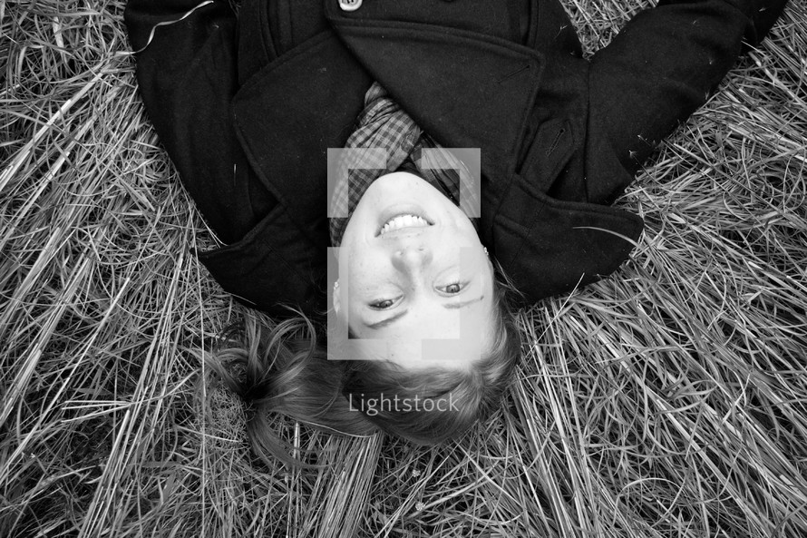 Woman laying in hay