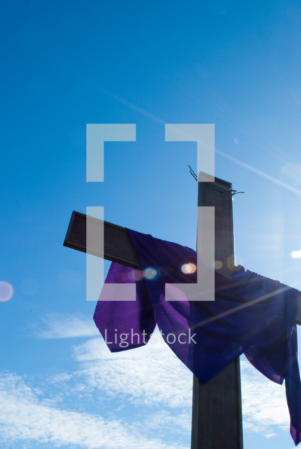 purple shroud draped over a cross