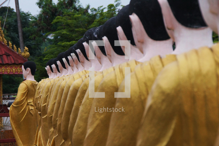 Statues of Buddhist monks dressed in robes
