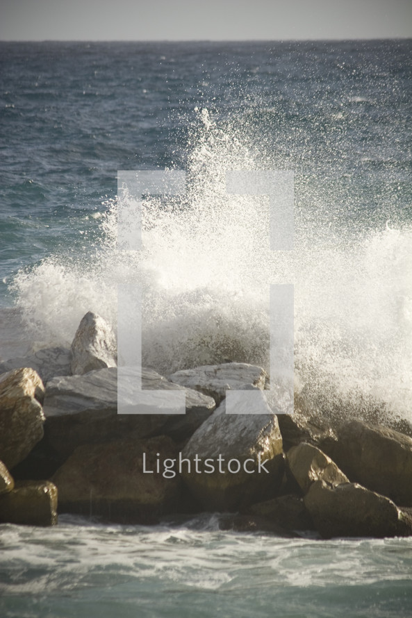 ocean crashing into rocks