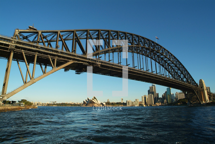 Sydney Harbor Bridge with the Opera House and Sydney Central Business District in the background.