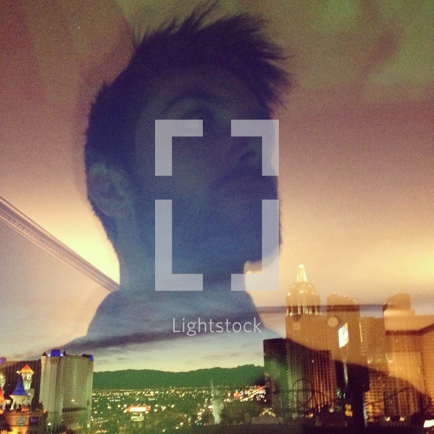 double exposure of a man and cityscape
