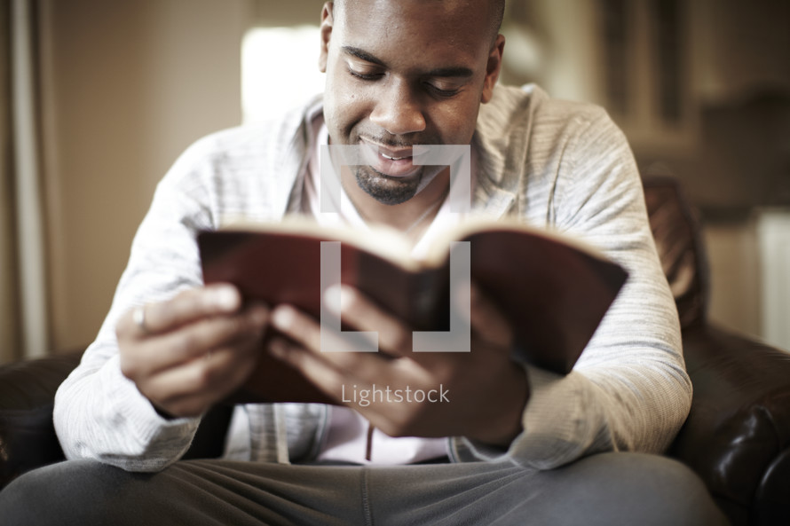 An African American man enjoying his Bible