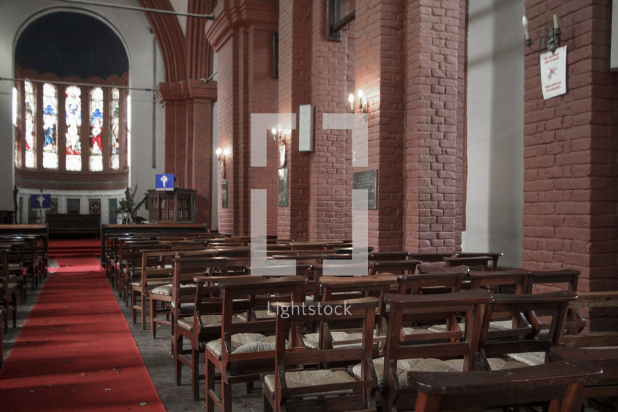 rose petals down the aisle of an empty church