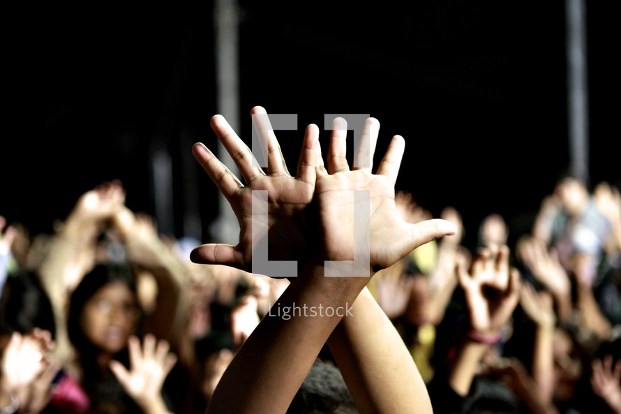 Hands raised during corporate worship