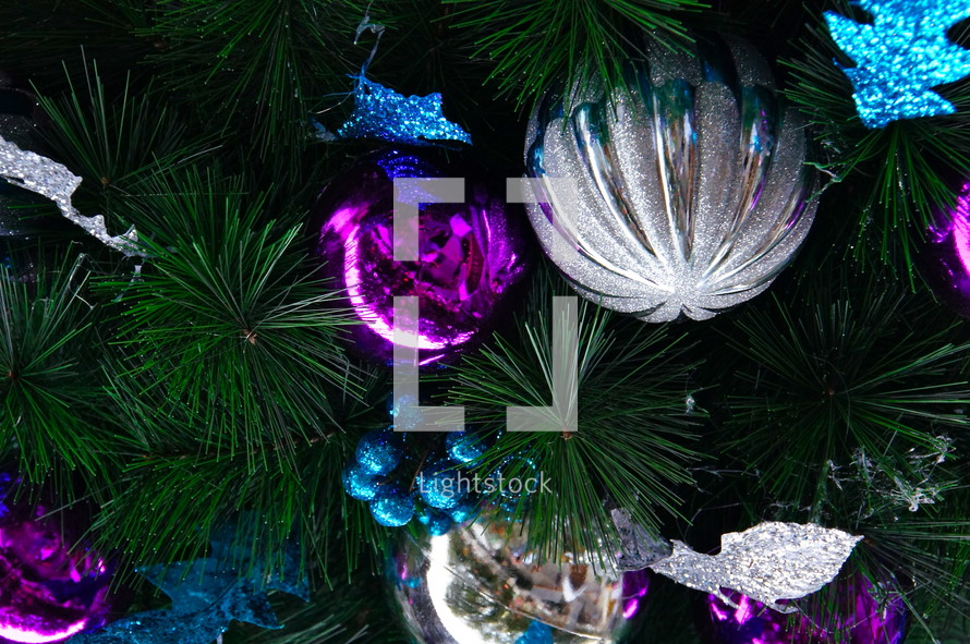 fuchsia, blue and silver ornaments on a Christmas tree