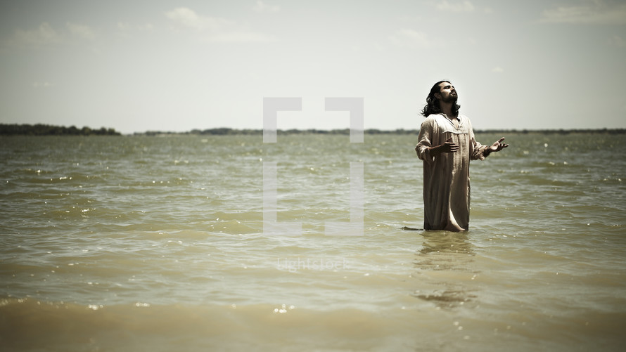 Jesus praying in the water before baptism
