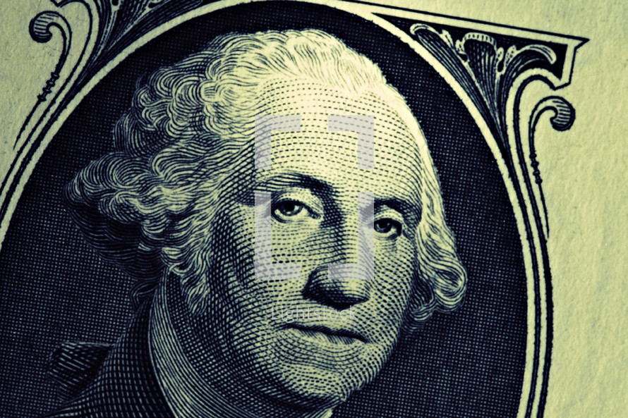 A close up of George Washington on a one dollar bill