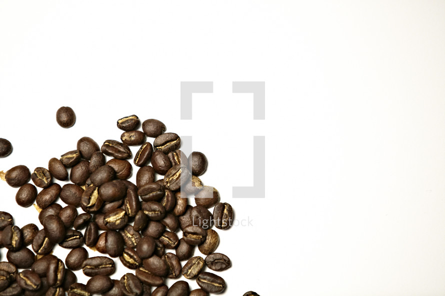 A pile of coffee beans isolated on white