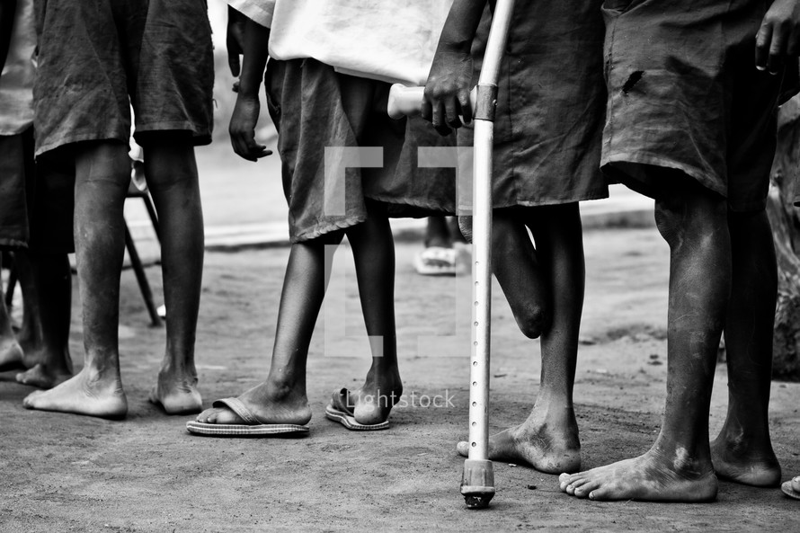 boy standing in line with crouches 