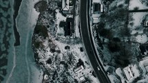 aerial view over a winter coastal highway 