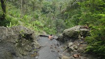 Bathing Soaking in Natural Forest Rock Pool Jacuzzi at Gembleng Waterfall Karangasem Bali Indonesia in Slow Motion