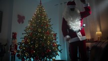 Happy Santa Dancing under the Christmas tree