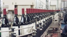 Wine bottle production line. Technological line for bottling of wine. Production of glass wine bottles.